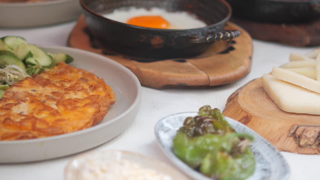 Delicious breakfast with omelet, fried egg, and salad