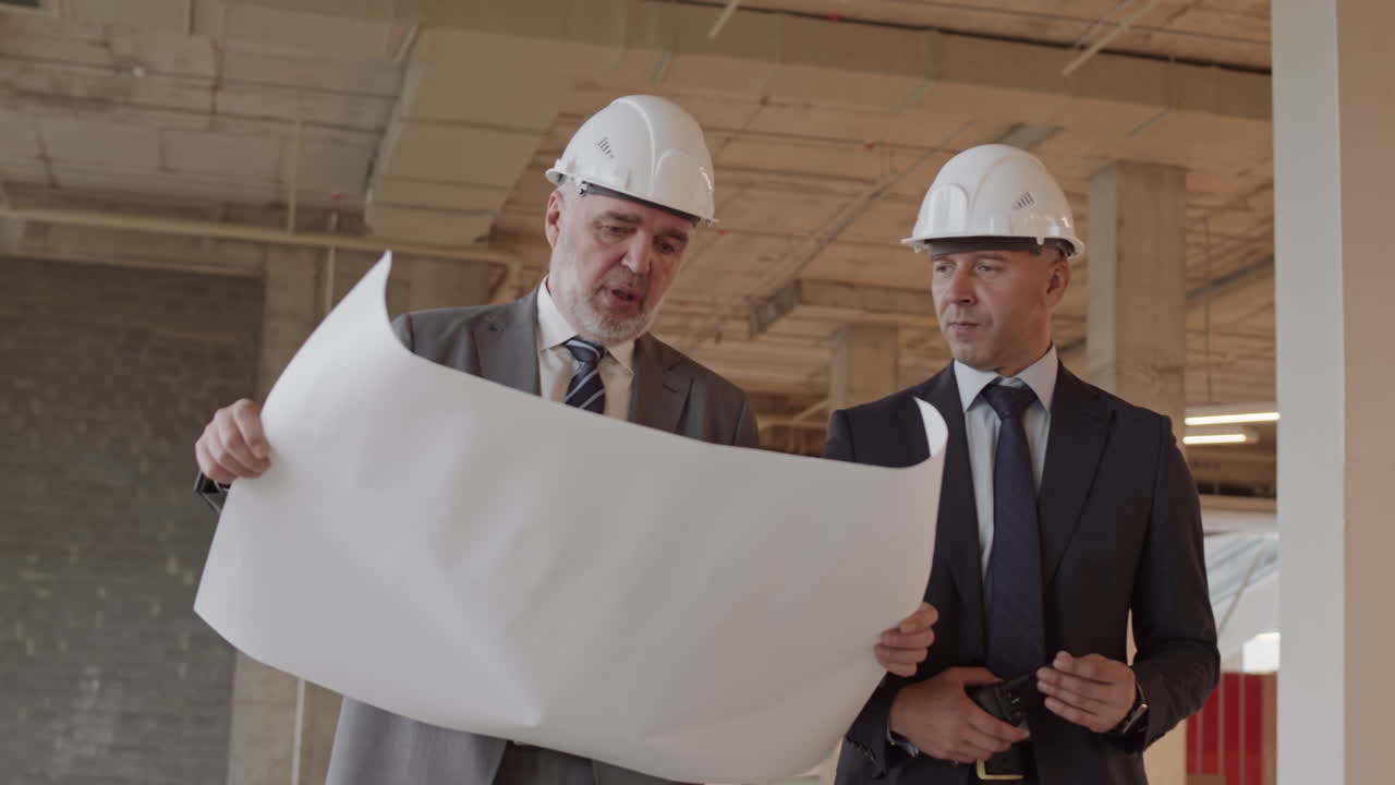 Businessmen Walking Around Construction Site