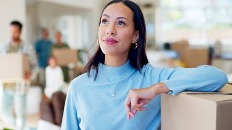 woman, moving a box and thinking about new house