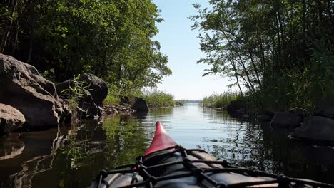 kayak floating in river, vibrant nordic nature