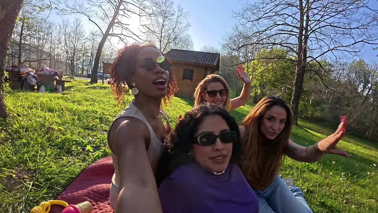 A group of women enjoying a picnic in the park