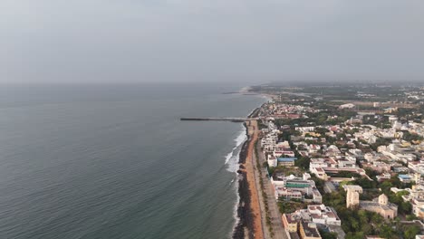 beachfront road and french heritage buildings captured from above at golden hour