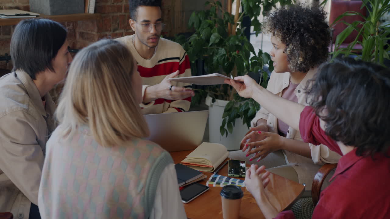 Diverse Team Meeting in a Coffee Shop