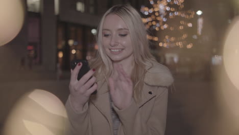 young woman searches for the perfect christmas gift and is excited when she finds it - in slow motion and ungraded