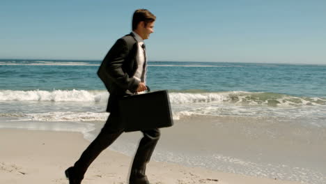 businessman running on the beach