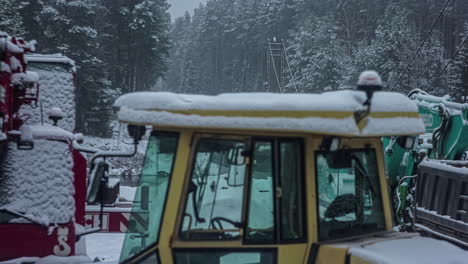 time lapse of snow building up on heavy machinery on a construction site