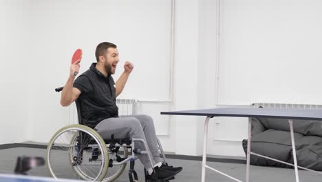 Of Young Attractive Bearded Man in Wheelchair Lifting Dumbbells in Gym of Young Attractive Bearded Man in Wheelchair Lifting Dumbbells in Gym Rehabilitation after Injuries Damage to the Lower Limbs Life with Disabilities