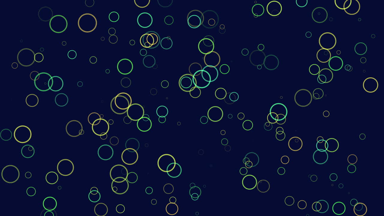 Vibrant circles of various sizes and colors fill a blue backdrop, creating a lively and energetic scene