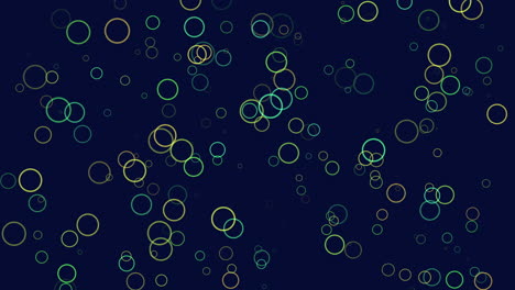 vibrant circles of various sizes and colors fill a blue backdrop, creating a lively and energetic scene