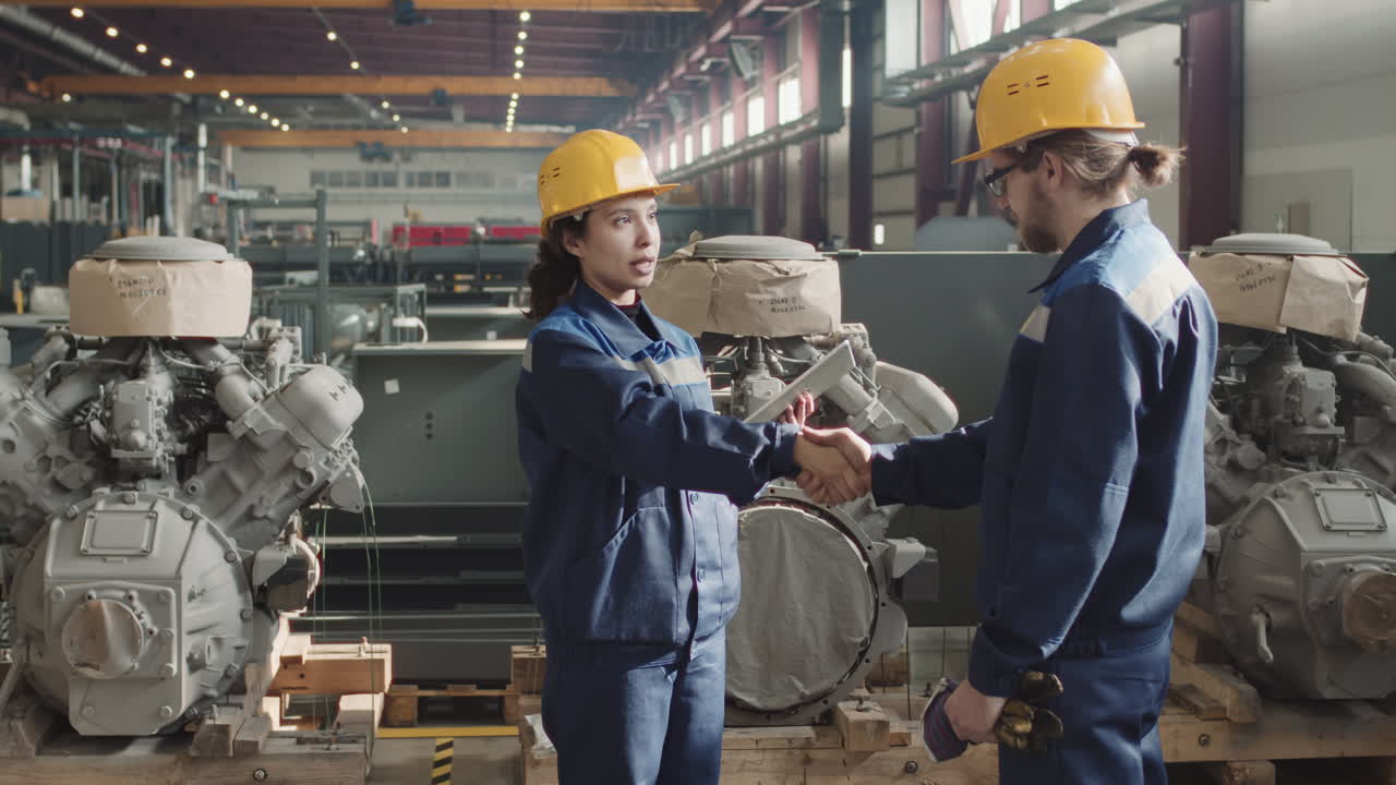 Plant Engineers Shaking Hands After Making Deal