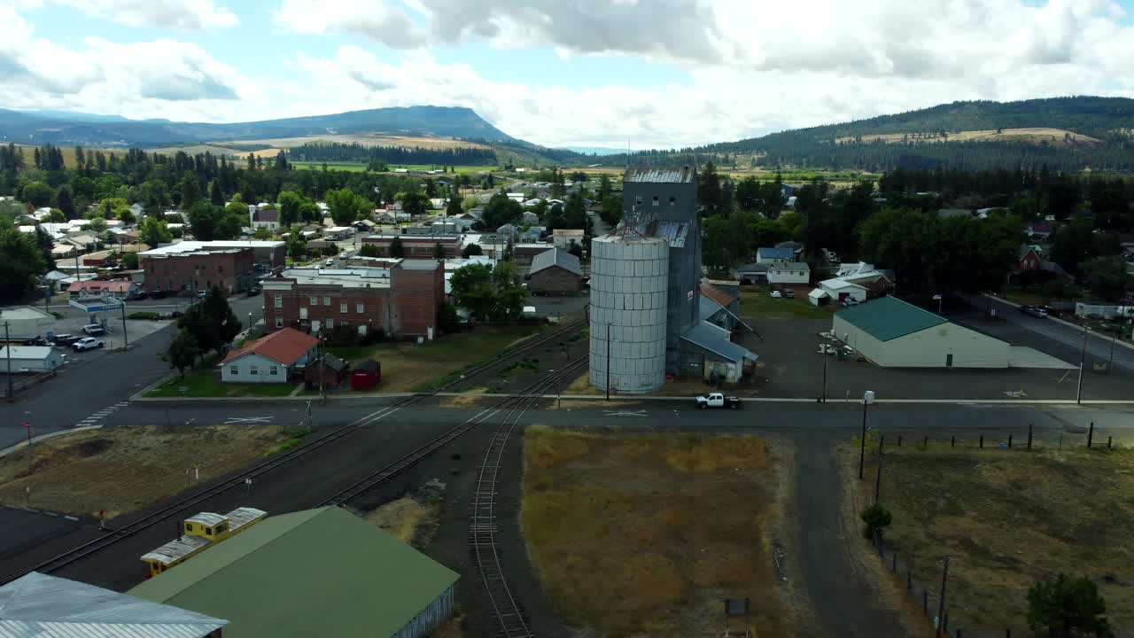 US, Oregon, Elgin, 2025-08-07 - Drone view of the abandoned grain elevator and city in Summer