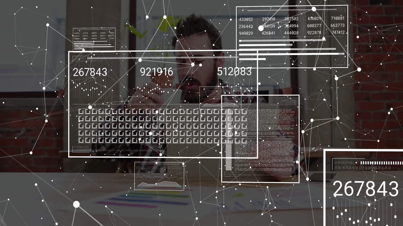 Man sitting at desk technology office interacting with floating network diagrams charts smartphone