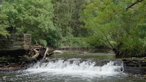 Waterfall-near-Covered-Bridge,-Thomas-Mill-at-the-Wissahickon-Creek