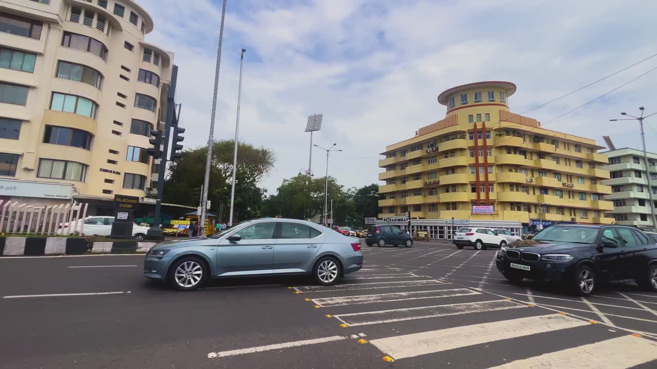 Busy Street Scene in India with Traffic and Public Transportation