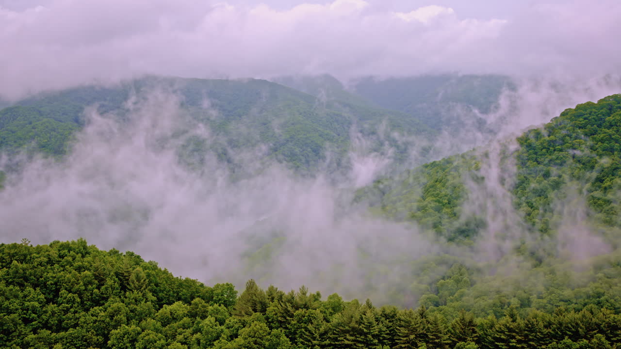Breathtaking drone shot of mist swirling through the Smoky Mountains