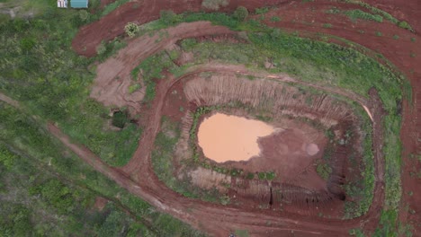 dry water pond in african farm in aerial above drone shot