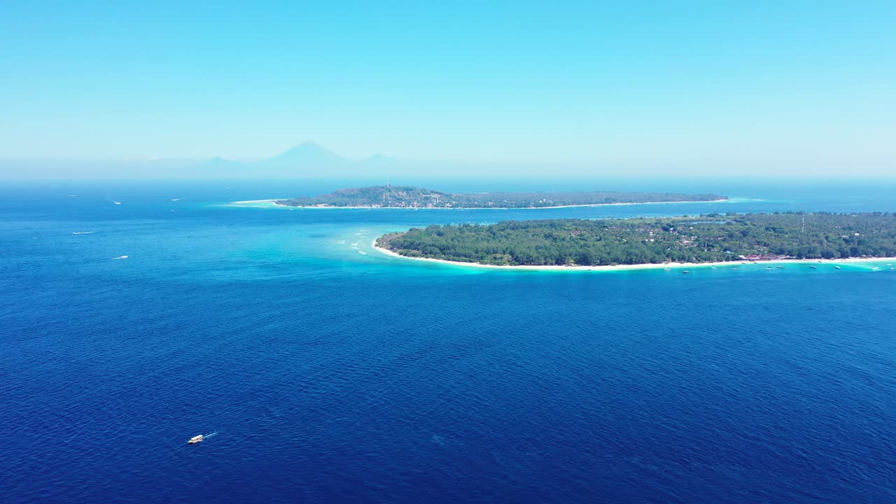 Vibrant blue and aqua waters off the coastline of the beautiful paradise island of Bali