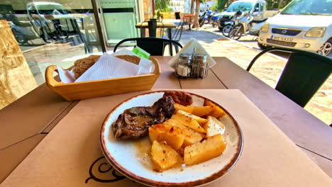 delicious greek meal: roasted meat with potatoes and bread