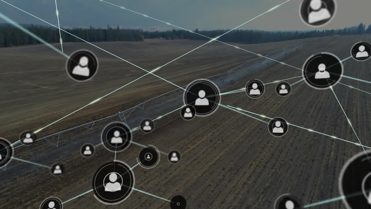 Network of connected user icons animation over rural landscape with fields