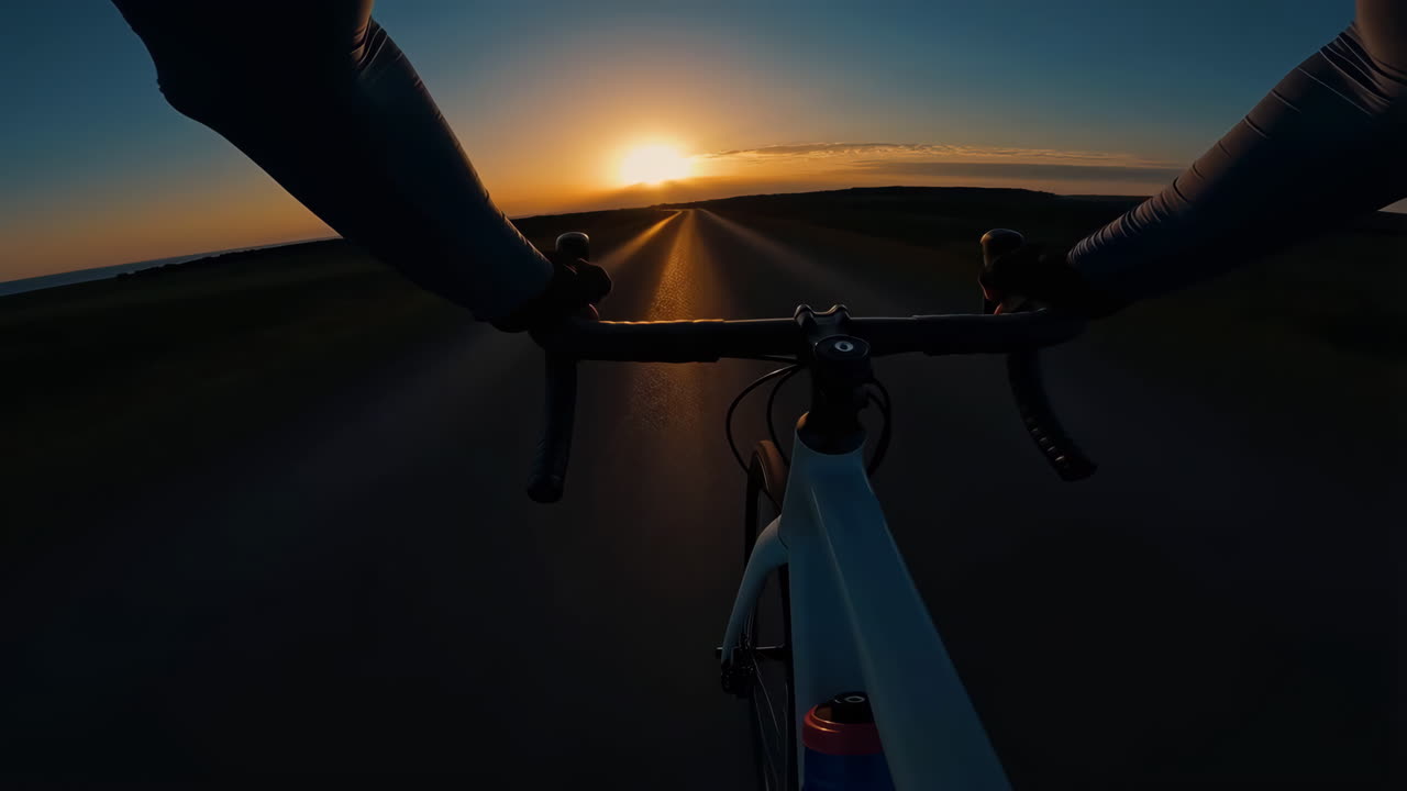 POV Cycling into the Sunset on an Open Road