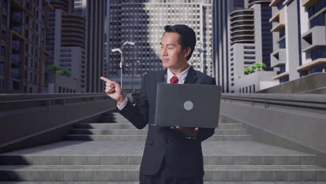Businessman with Laptop Outdoors