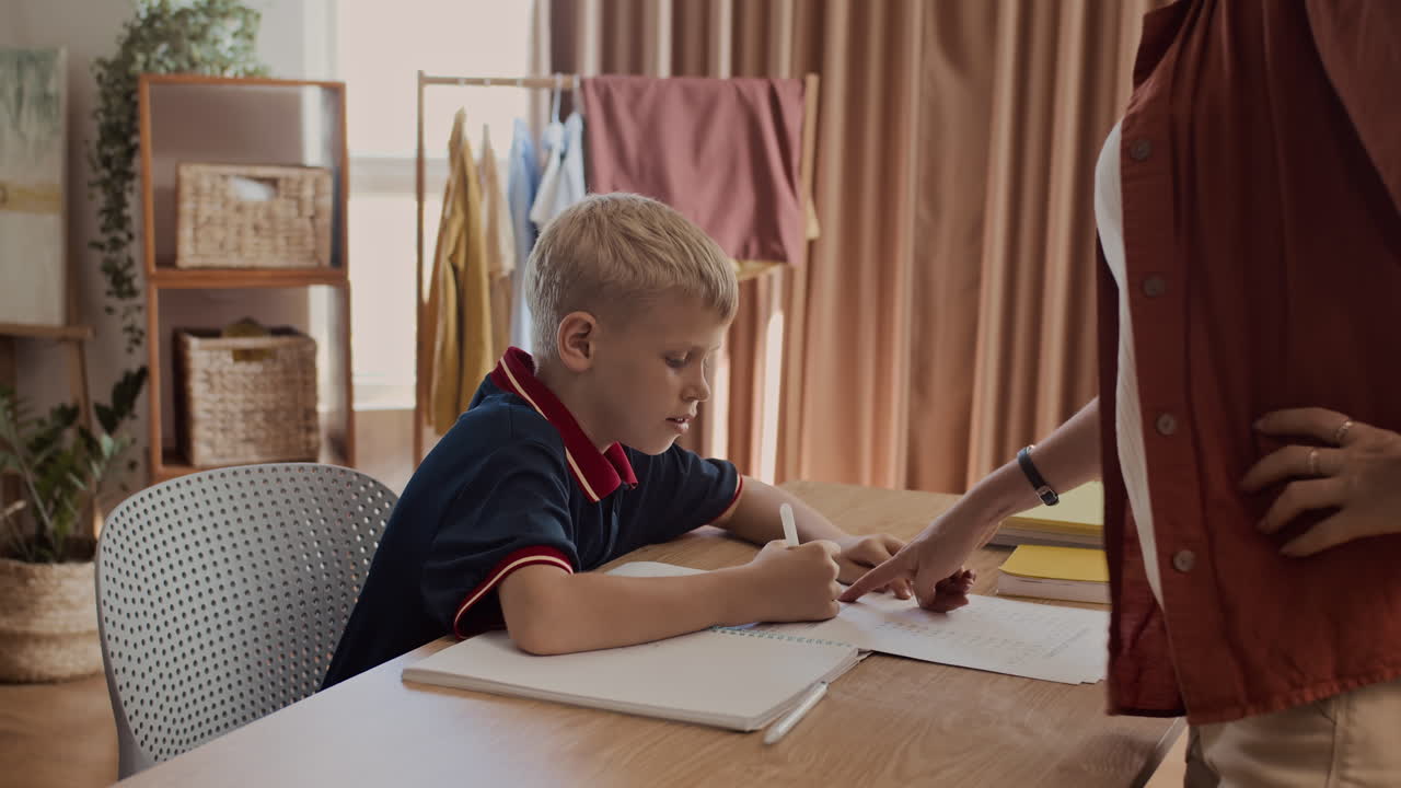 Mother Telling Son to Do His Homework Properly