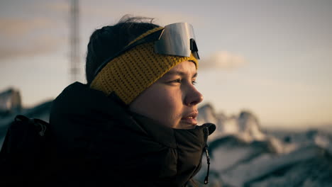 Bokeh-shot-of-a-female-hiker-at-the-peak-of-a-mountain-enjoying-the-views