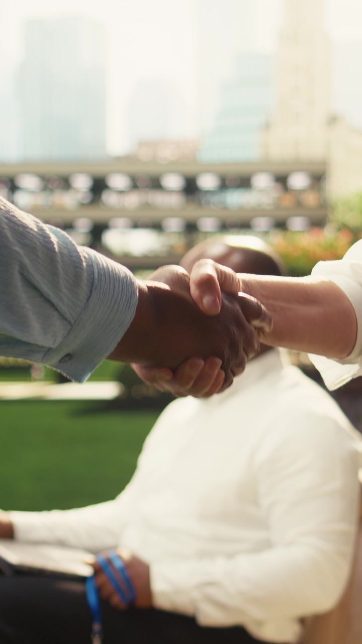 Vertical Video Close up hands shaking after outdoor work discussion for successful deal