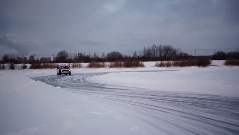 car drifting on frozen lake in winter