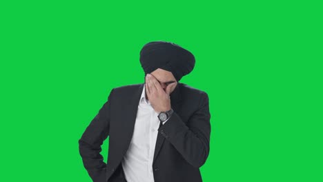 stressed and tensed sikh indian businessman green screen