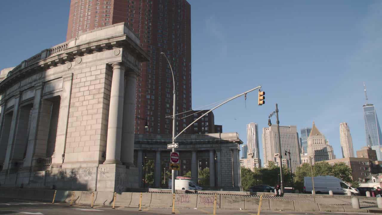 Traffic passing through Manhattan. Shot at the exit of the Manhattan Bridge with the Financial District in the background