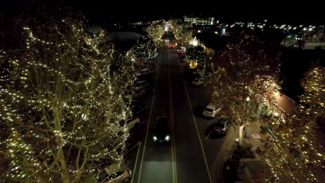 christmas lights at night on trees and street in neighborhood of santa clarita, los angeles ca, drone aerial view