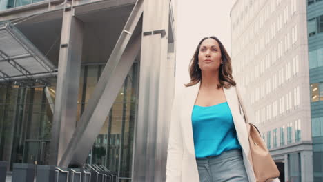 woman checking her phone in the city