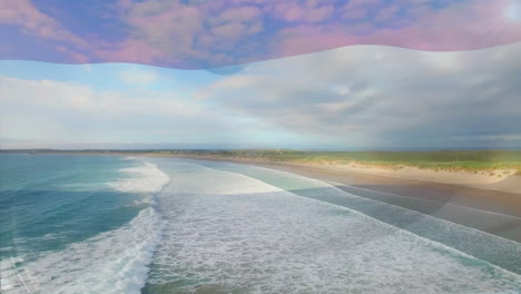 animación de la bandera de los países bajos ondeando sobre el paisaje de la playa