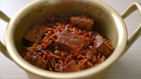 jjapaguri or chapaguri, korean black beans spicy noodles with beef - korean food style