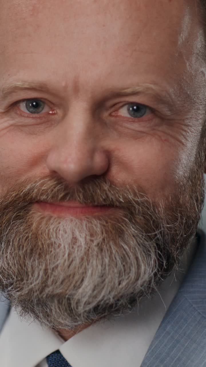Close-up portrait of a middle-aged man in a suit