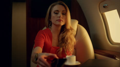 beautiful businesswoman talking cellphone closeup. corporate luxury jet trip.
