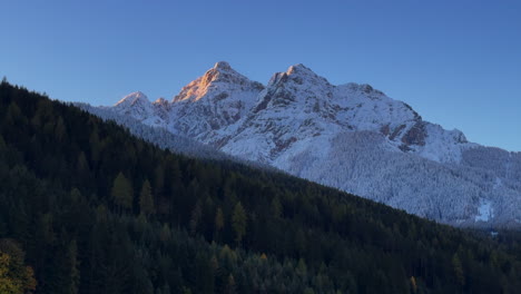 early november stubai stubaital morning first light snow on europe australian swiss alps peaks fall autumn village chalet tirol tyrol austria frosted sunshine innsbruck mountains lark forest landscape