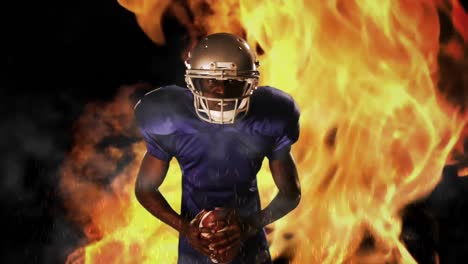 american football player holding ball