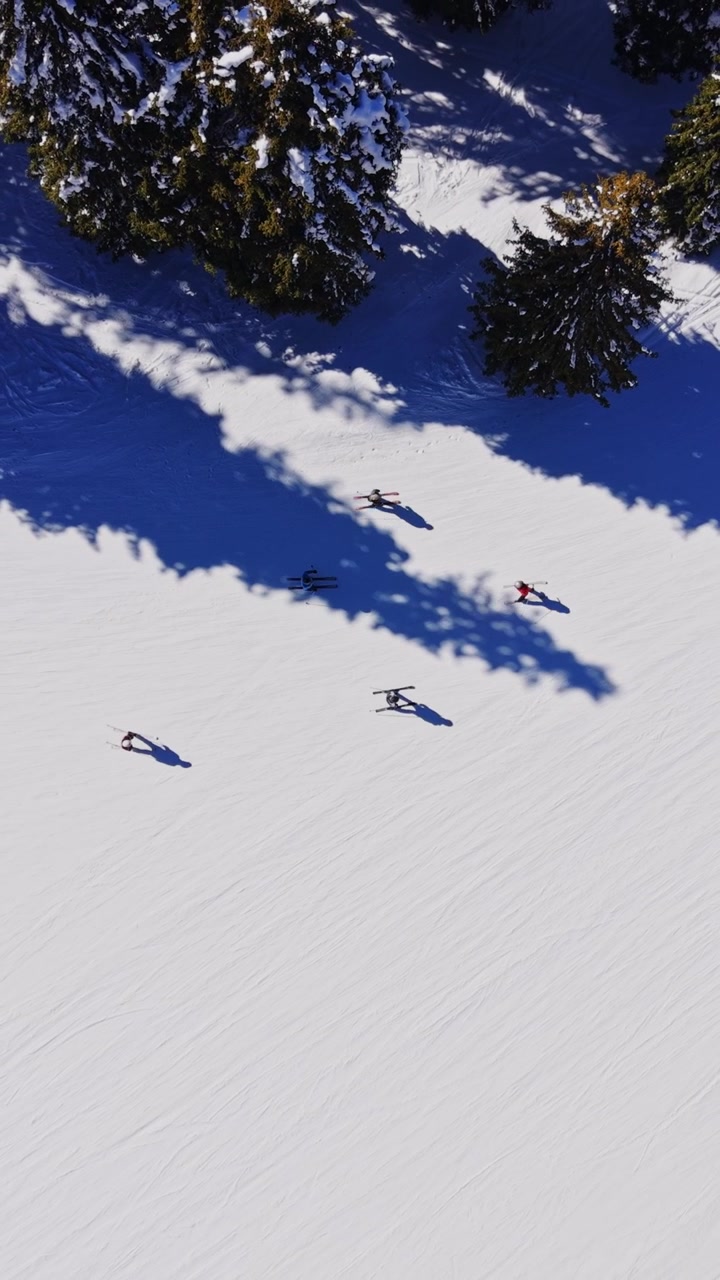 Skiers moving on a snowy slope in the Carpathians of Bulgaria