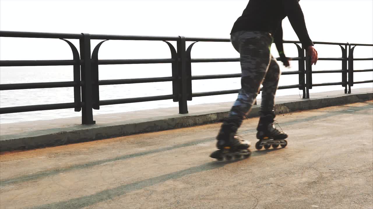 Person Rollerblading near Water