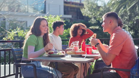 group of friends enjoying lunch outdoors