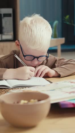 boy drawing at table