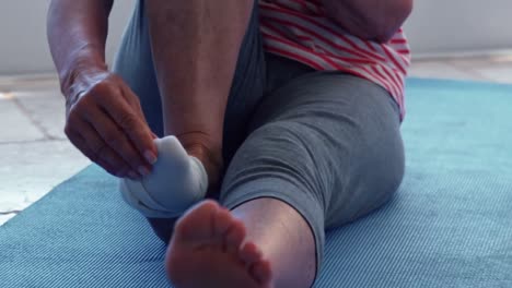 Senior-couple-removing-their-shoes-at-home