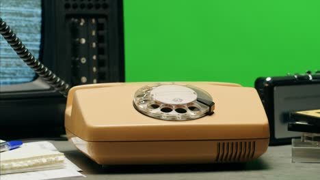 retro vintage phone, a yellow rotary telephone is displayed on a wooden desk, adding a nostalgic touch