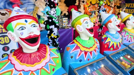 clown heads at a carnival game