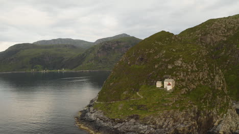 coastal tower of hendanes lighthouse at the western shore of the island of vagsoy in vestland county, norway