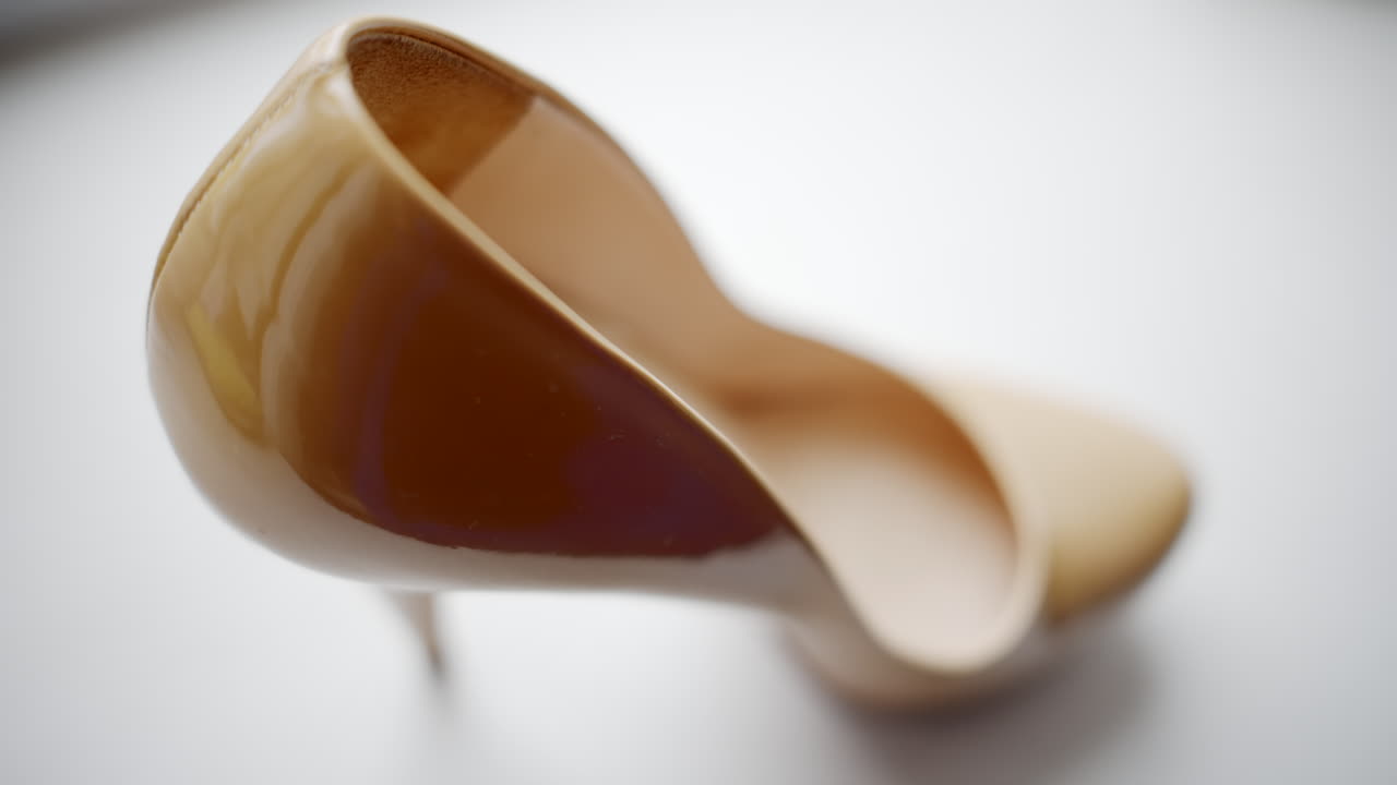 Beige woman high heels shoes close up composition