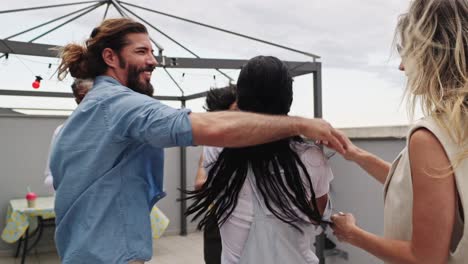 group of friends celebrating at a rooftop party