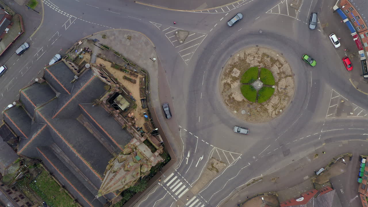 Static aerial view of traffic circulating Carlisle Circus roundabout and Carlisle Memorial Church. Belfast